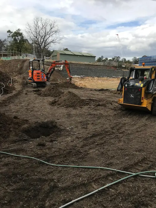 Machine and operator on a residential site